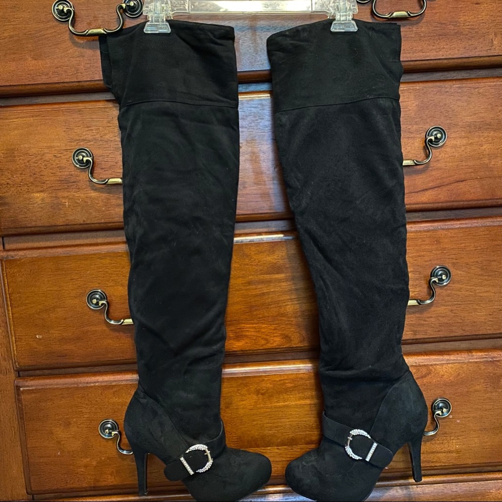 Thigh high, high heeled boots